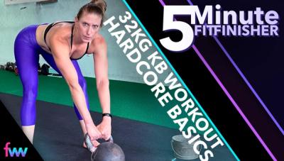 Kindal getting ready to start swinging a 32 kg kettlebell with a smile on her face.