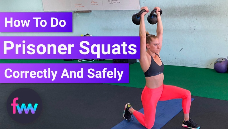 Kindal doing a double kettlebell overhead prisoner squat.