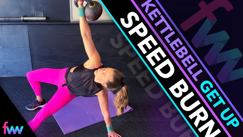 Kindal halfway through the kettlebell get up getting ready to bring her foot back so she can get up to kneeling.