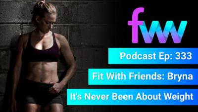 Kindal leaning against a wall looking fit and toned.