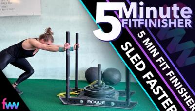 Kindal pushing the dog sled.