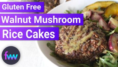 A salad bowl topped with a vegetarian mushroom and rice burger.