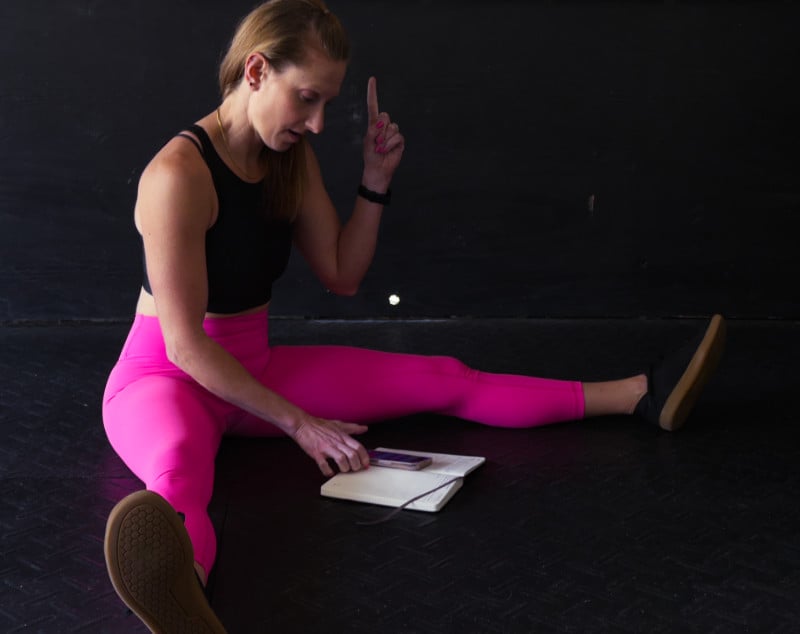 Kindal on her studio floor realizing the idea for fitness based to-do trainning plans.