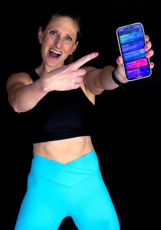 Kindal holding up the Ignite 30 app