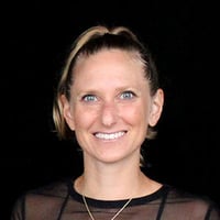 Kindal smiling and being a coach.