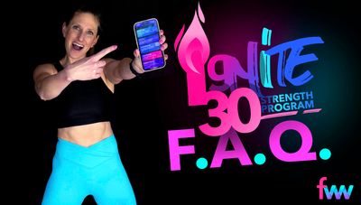 Kindal holding up her phone with the Ignite 30 app on it.