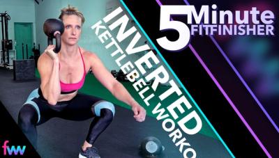 Kindal in the bottom of a squat with an inverted kettlebell.