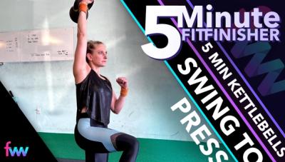 Kindal pressing in the kneeling position as she stays braced and really tall.