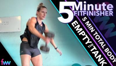 Kindal in the middle of a dumbbell snatch.