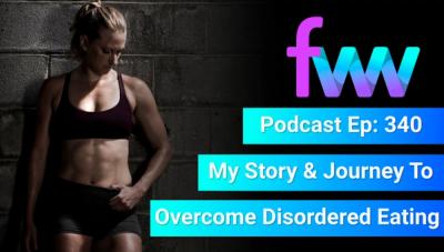 Kindal looking fit while leaning against a wall. 