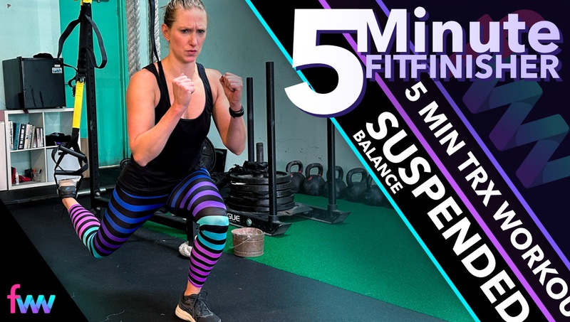 Kindal at the bottom of the TRX split squat fighting the muscle burn as she completes her last reps.